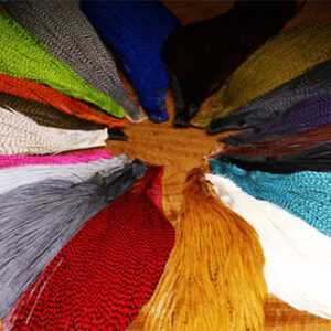 A close up of many different colored yarn