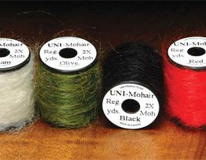 A group of four different yarn spools.