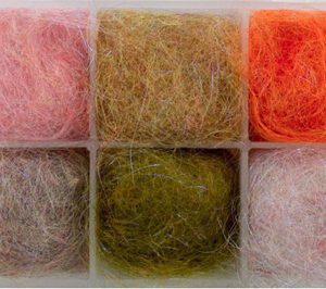 A box of different colored yarn in it.